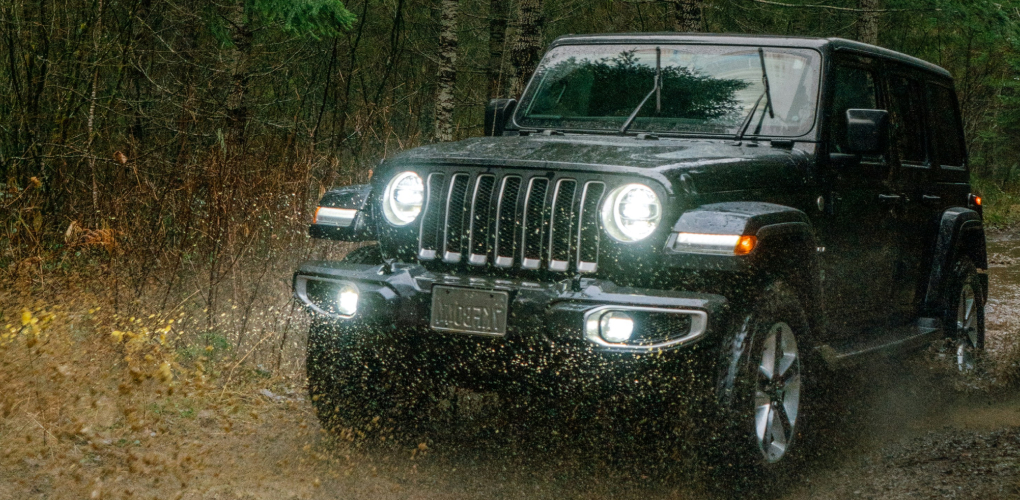 jeep driving through mud